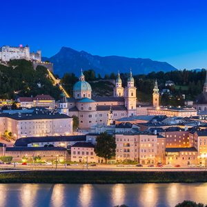 View of cityscape of Salzburg Cathedral, Fortress Hohensalzburg, and old castle in center of old town