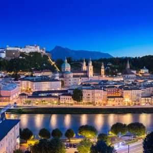 View of cityscape of Salzburg Cathedral, Fortress Hohensalzburg, and old castle in center of old town