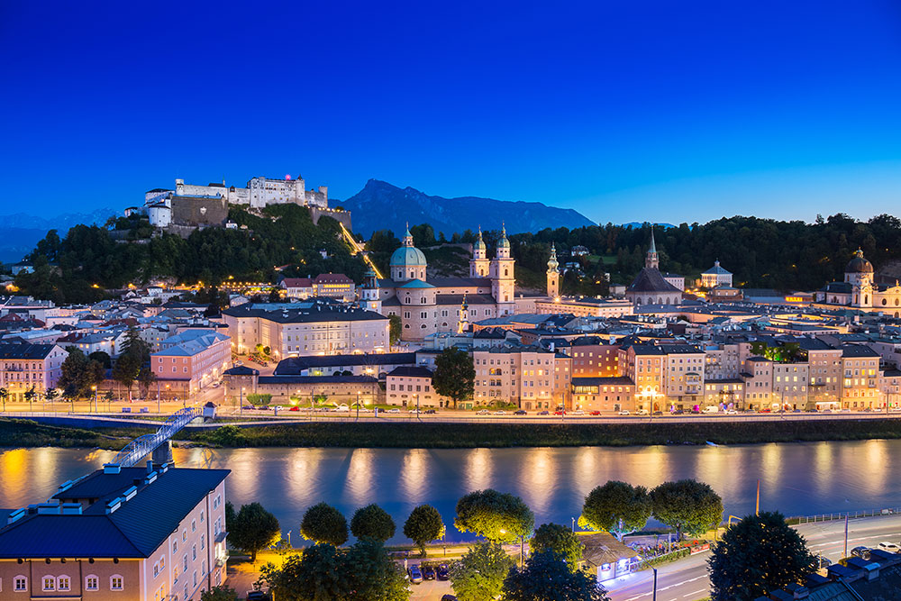 View of cityscape of Salzburg Cathedral, Fortress Hohensalzburg, and old castle in center of old town