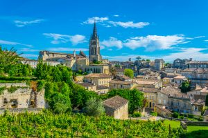 Aerial view of French village Saint Emilion dominated by spire of the monolithic church