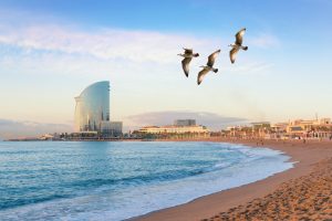 Barceloneta Beach in Barcelona with colorful sky at sunrise