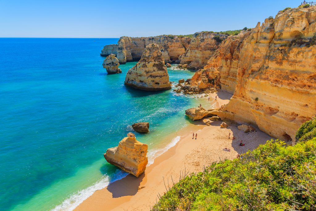 View of beautiful Marinha beach with crystal clear turquoise water near Carvoeiro town, Algarve region