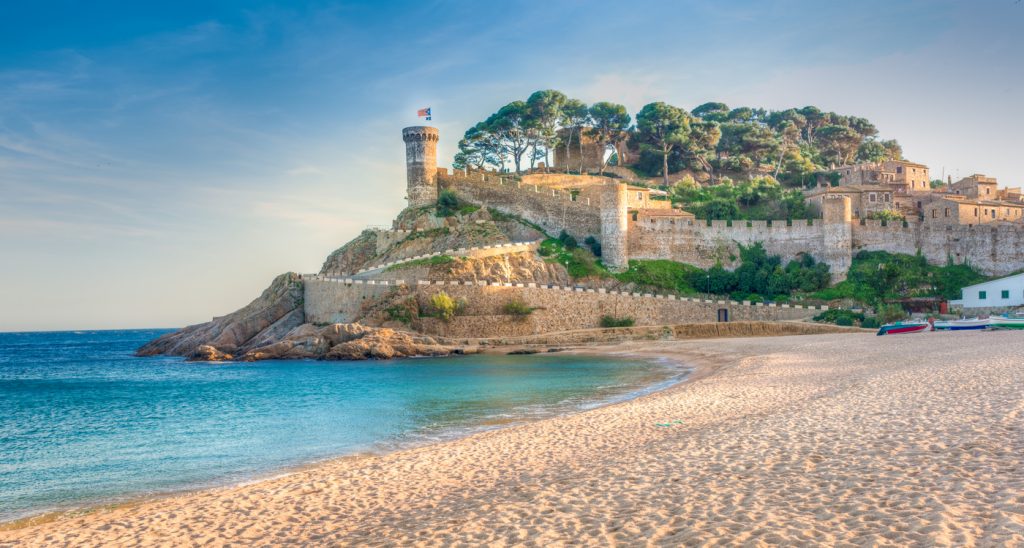 View of the fortified walls of the Vila Vella of Tossa de Mar from the beach.