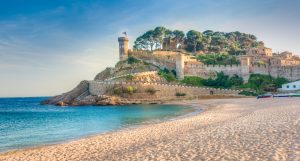 View of the fortified walls of the Vila Vella of Tossa de Mar from the beach.