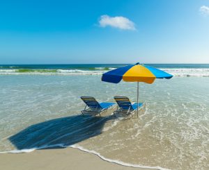 Beach chairs and beach umbrella in Daytona Beach. Florida, USA
