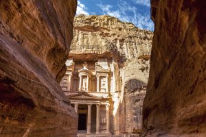 incredible and breathtaking view of the Al-Khazneh treasury through the walls of the canyon al-Siq