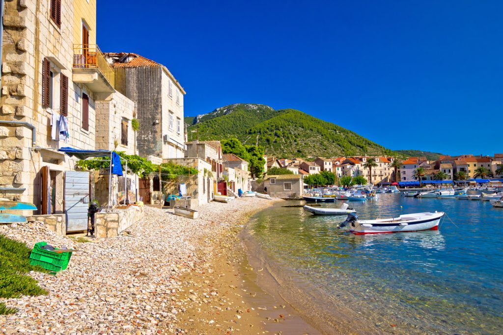Komiiza city beach and ancient architecture, Vis island, Croatia