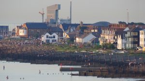 Whitstable and the sweeping bay with the Neptune Pub on the beach and Oyster House