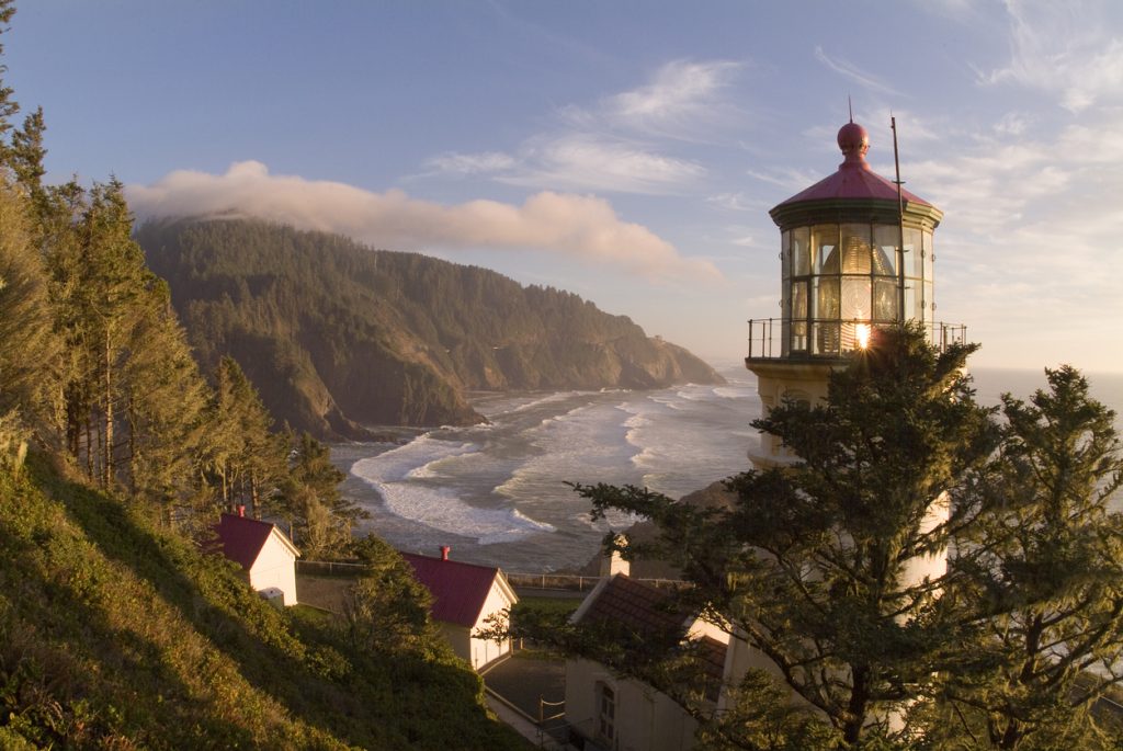 The Light from Heceta Head Lighthouse sends Beam from its First Order Fresnel Lens across the Coast. A Fully Operational Lighthouse operated by Oregon State Parks and Coast Guard. 