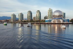 View of the Vancouver skyline of Science World and nearby buildings from the water of False Creek