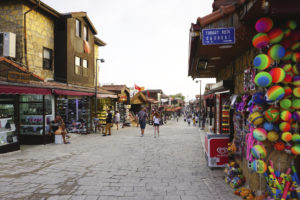 Tourists are wandering the streets of the antique city of Side, Turkey