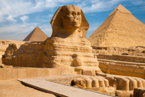 A beautiful profile of the Great Sphinx including the pyramids of Menkaure and Khafre in the background in Giza, Cairo, Egypt