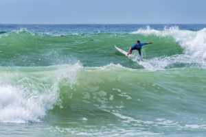 Surfer riding a nice wave during World surf league competition in Lacanau