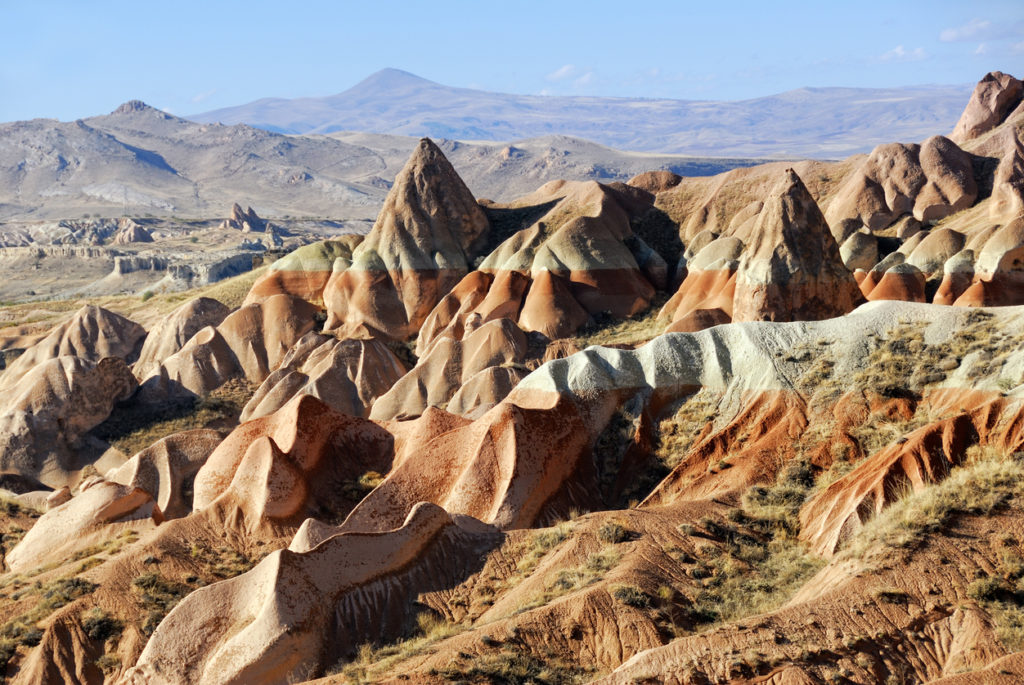 View of Cappadocia. Turkey. Unusual landscape with a cliff at evening time