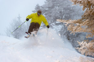 An expert skier on a powder morning, Stowe, Vermont