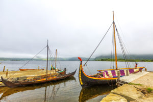 Old Viking ship on a lake on a cloudy day in Lofoten Islands. Norway.