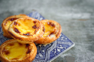 Portugal egg tart Pastel de Nata with an Azulejo tile plate