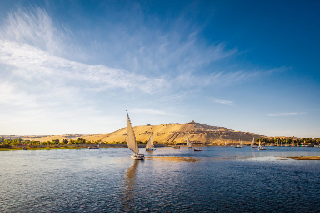 River Nile with traditional boats at sunset