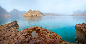 Sea tropical dawn landscape with mountains and fjords, Oman