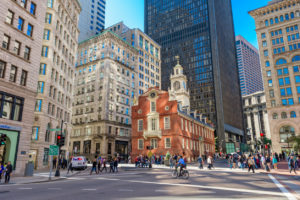 Pedestrians cross at the Old State House in Boston. The building dates from 1713.