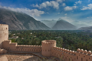 View of mountains and date palms in Oman