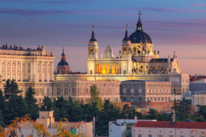 Madrid skyline with Santa Maria la Real de La Almudena Cathedral and the Royal Palace during sunset