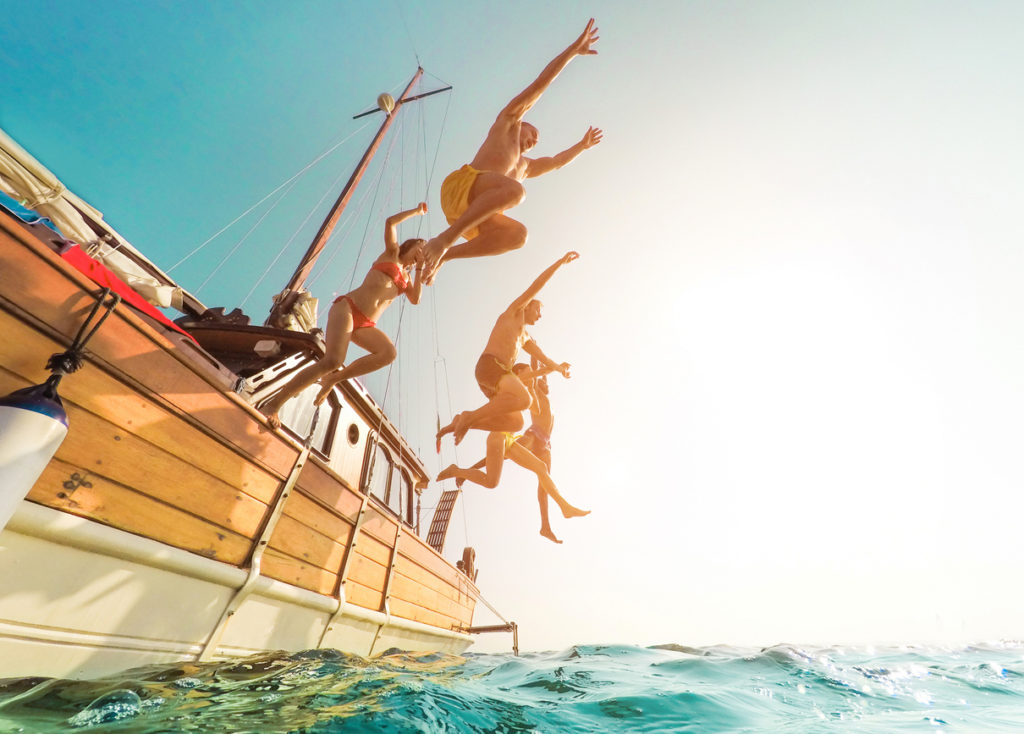 Jumping into the ocean in summer excursion day