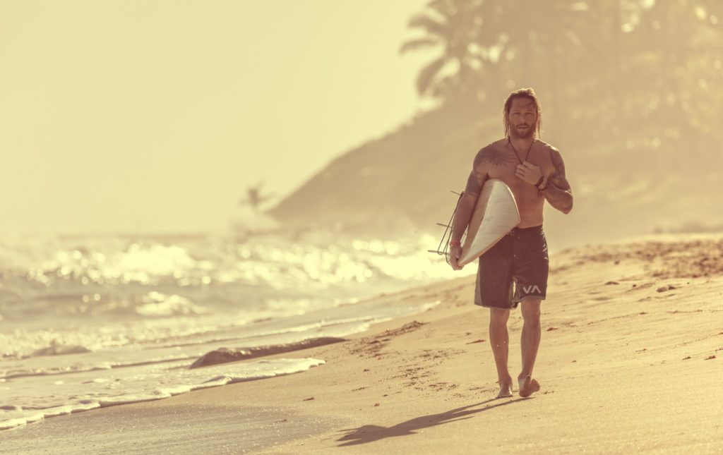 Surfer on the beach in the Dominican Republic