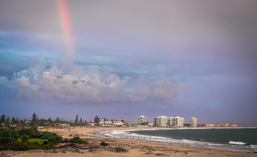 A rainbow appears over the small seaside town of Coronado, California.