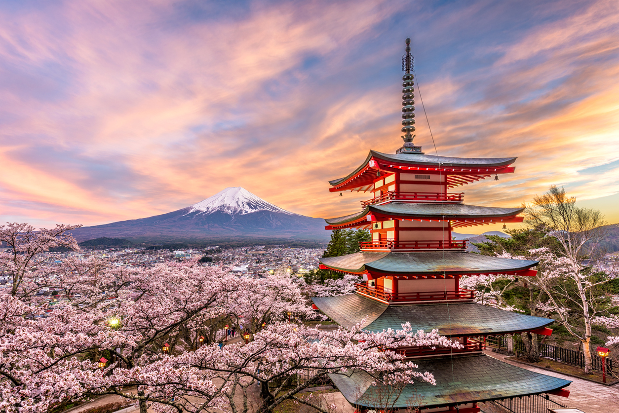 Fujiyoshida, Japan at Chureito Pagoda and Mt. Fuji in the spring with cherry blossoms.