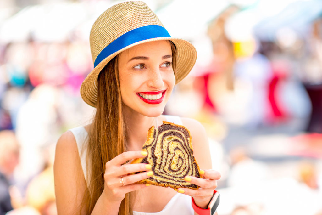 Woman eating traditional slovenian dessert