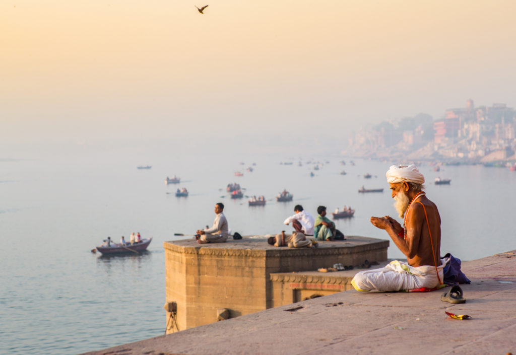 morning prayer by the river Ganges in Varanasi, India