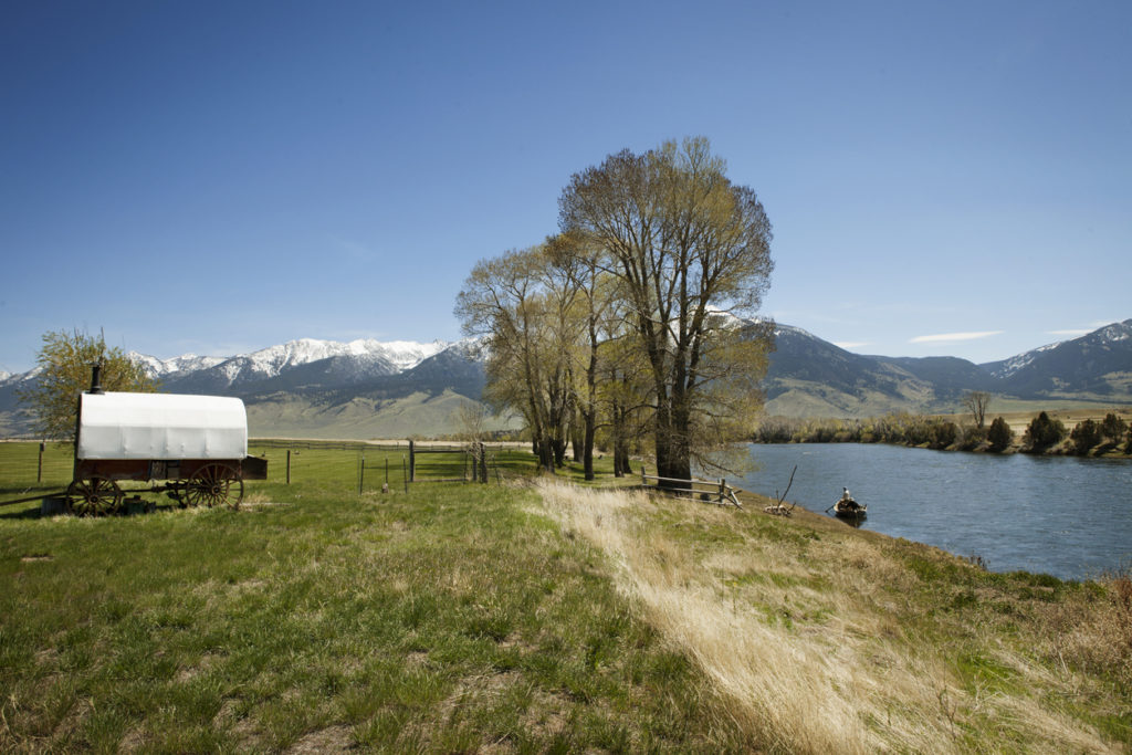 Covered wagon along side the Yellow Stone River, in beautiful Montana