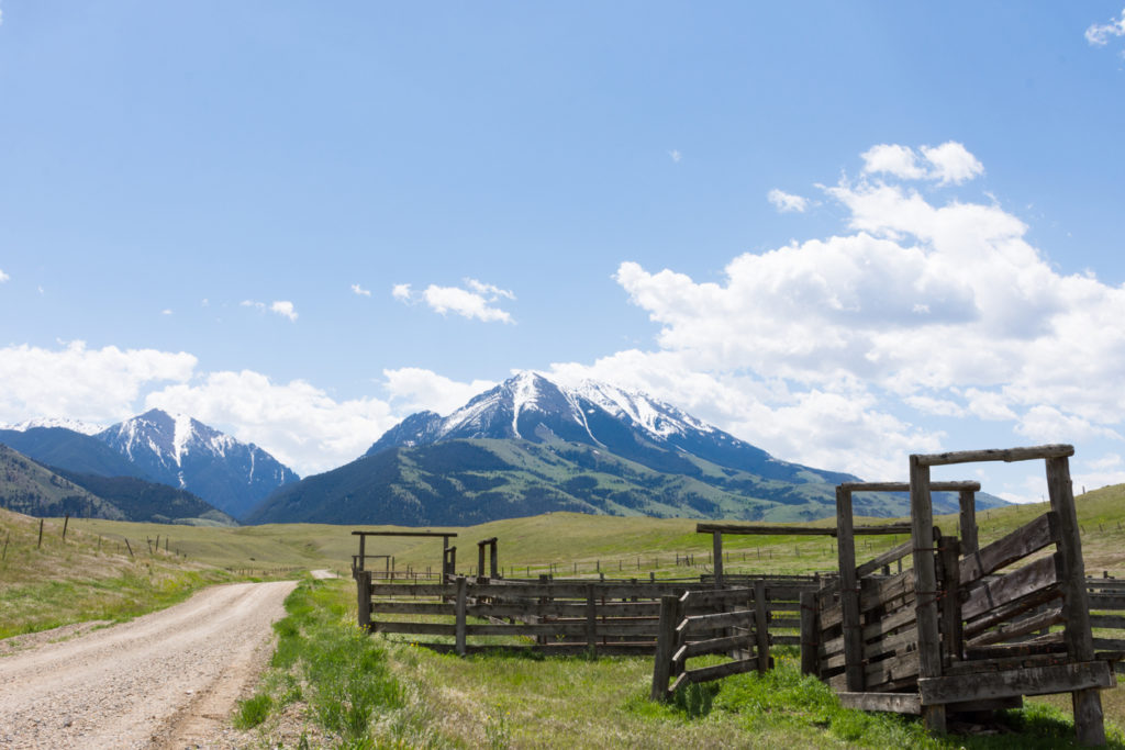 Old Wooden Corral with Rugged Mountains