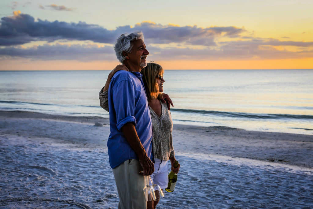 Active retirees enjoy the sunset on Siesta Key beach