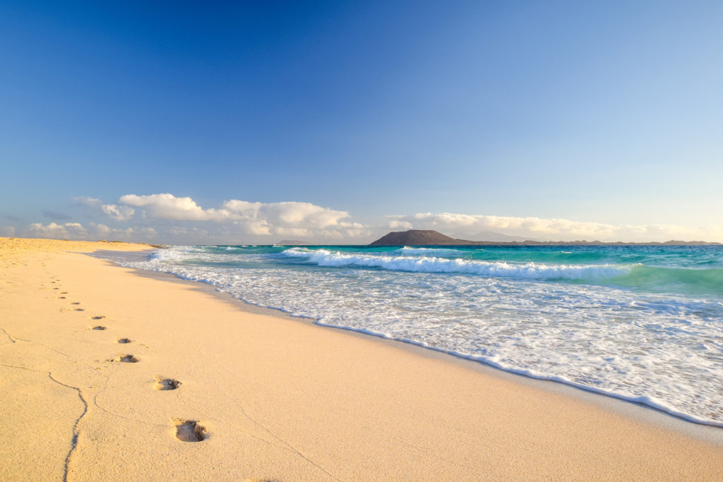 Stunning morning view of the islands of Lobos and Lanzarote seen from Corralejo Beach