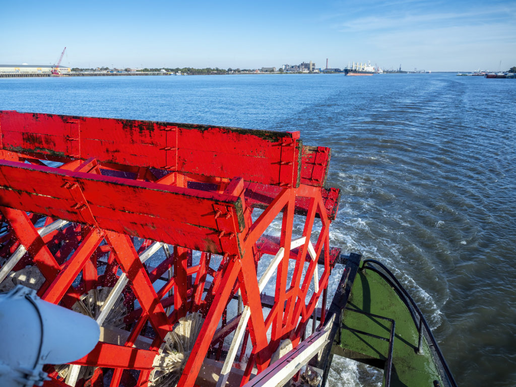 The red wooden paddle-wheel of a historic Steamboat