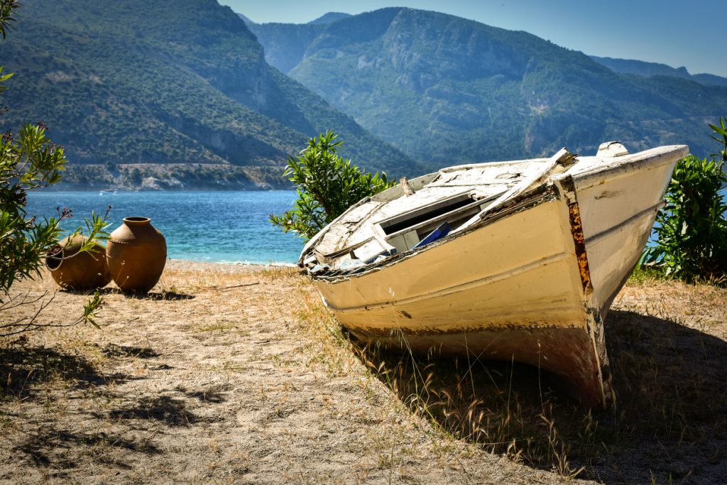 Abandoned boat on a sandy beach in Oludeniz Turkey