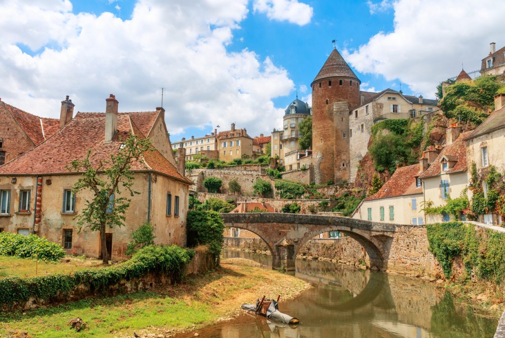 Quaint river through the medieval town of Semur en Auxois, Burgundy, France