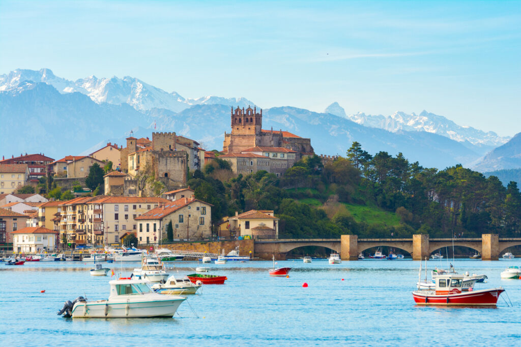 San Vicente de la Barquera Spanish town with mountain range at the background