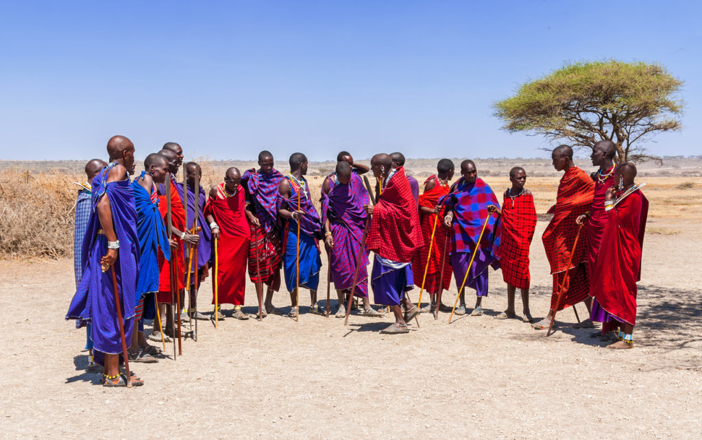 Massai men in colorful cloth in a Massai village, Tanzania