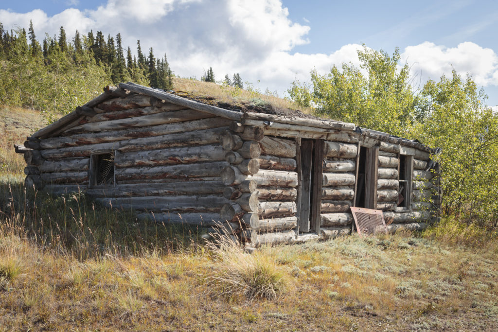 Old abandoned cabin, in city of Champagne in Yukon