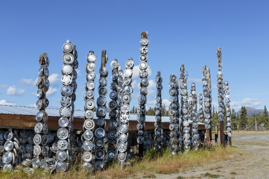 Totems made with hubcap, in city of Chamapgne in Yukon, Canada
