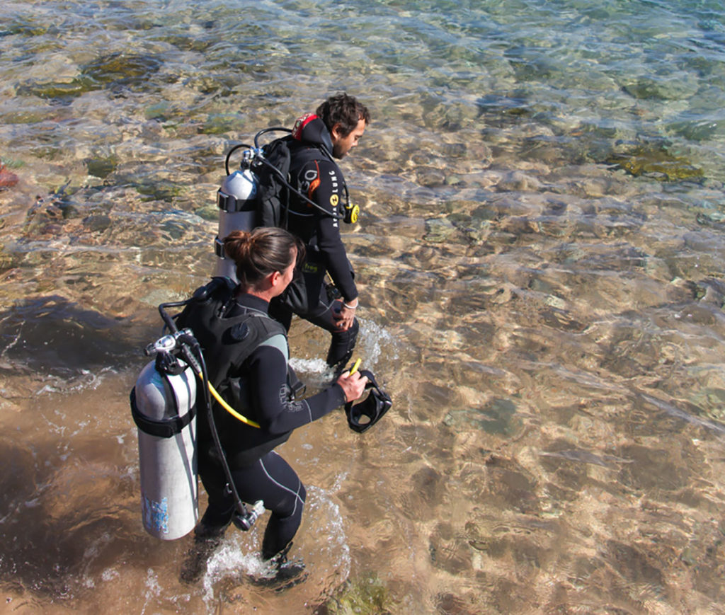 Two Divers enter to sea in Dahab