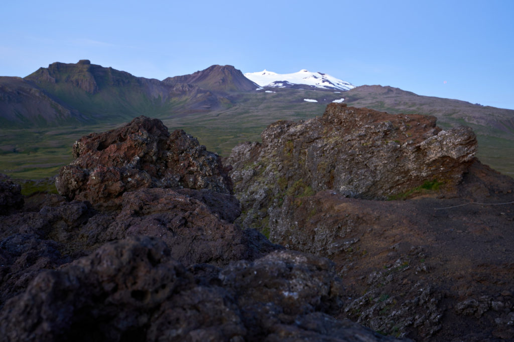 Beautiful view of the saxholl crater rock path in the foreground and with the Snæfellsjökull glacier in the distance