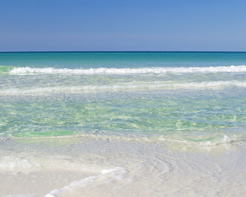 Green and turquoise waves on the Emerald Coast, Florida.