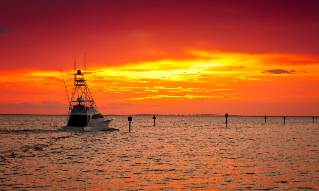 Large fishing boat going out for a sunset cruise in Destin, Florida