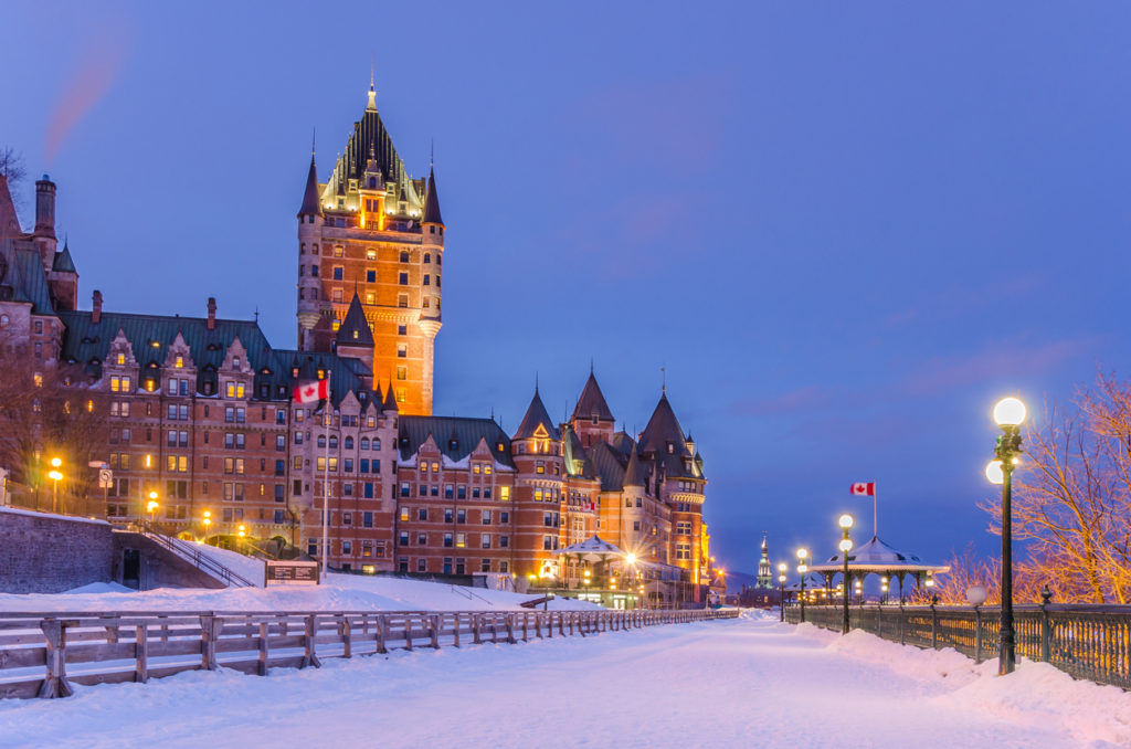 Night view of Chateau Frontenac in winter with Terrace Dufferin covered in snow, Quebec City, Canada.