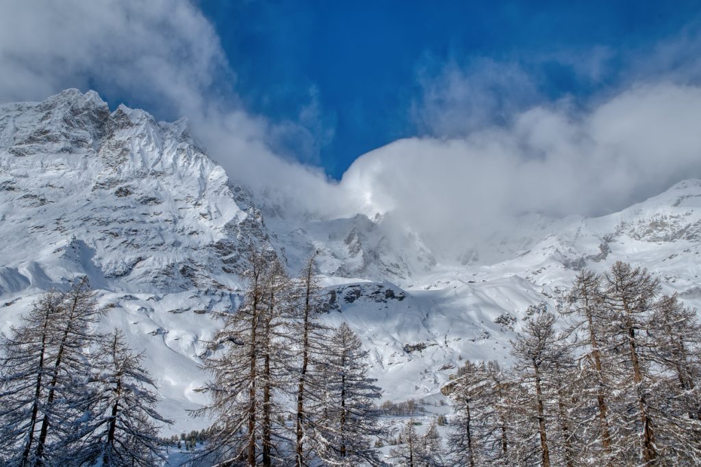 View Italian Alps and Matterhorn Peak under the clouds in December, Breuil-Cervinia