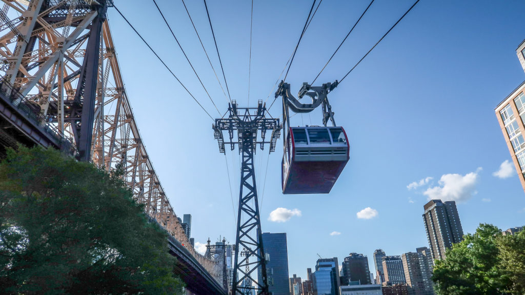 Roosevelt Island Tramway over city and East River at Manhattan